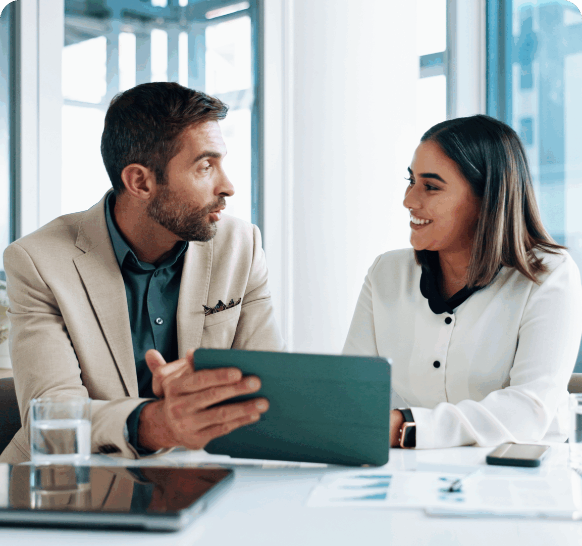 Two colleagues discussing work with tablet.